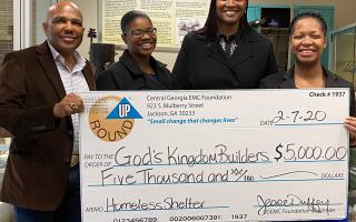Kingdom Builders receive Operation Round Up Check